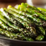 Delicious roasted asparagus seasoned and ready to serve as a healthy side dish.